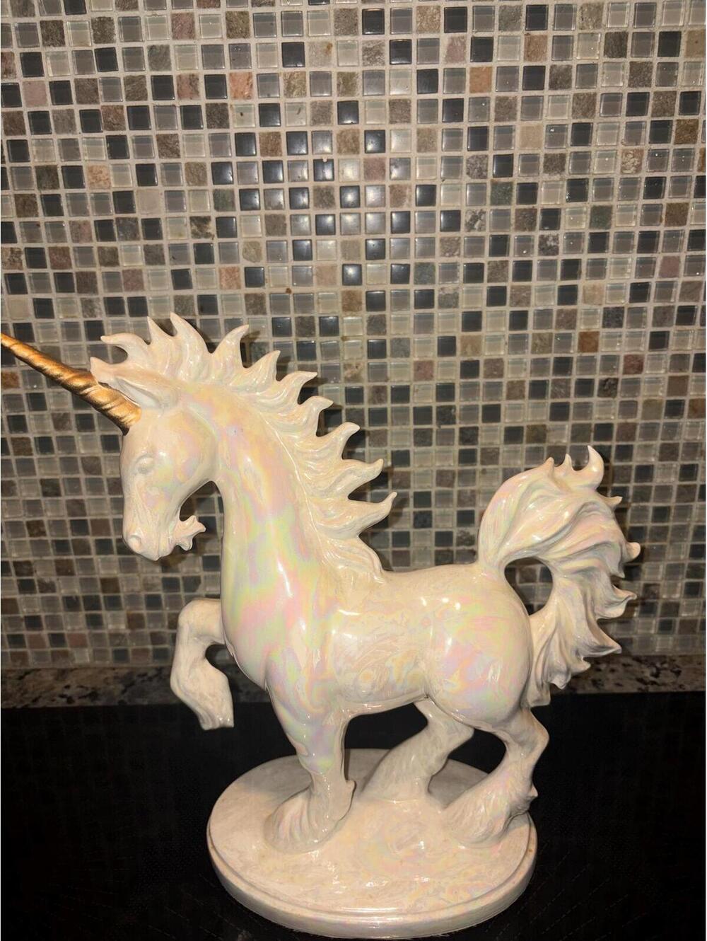 This is a vintage 1980s iridescent glazed ceramic unicorn statue.